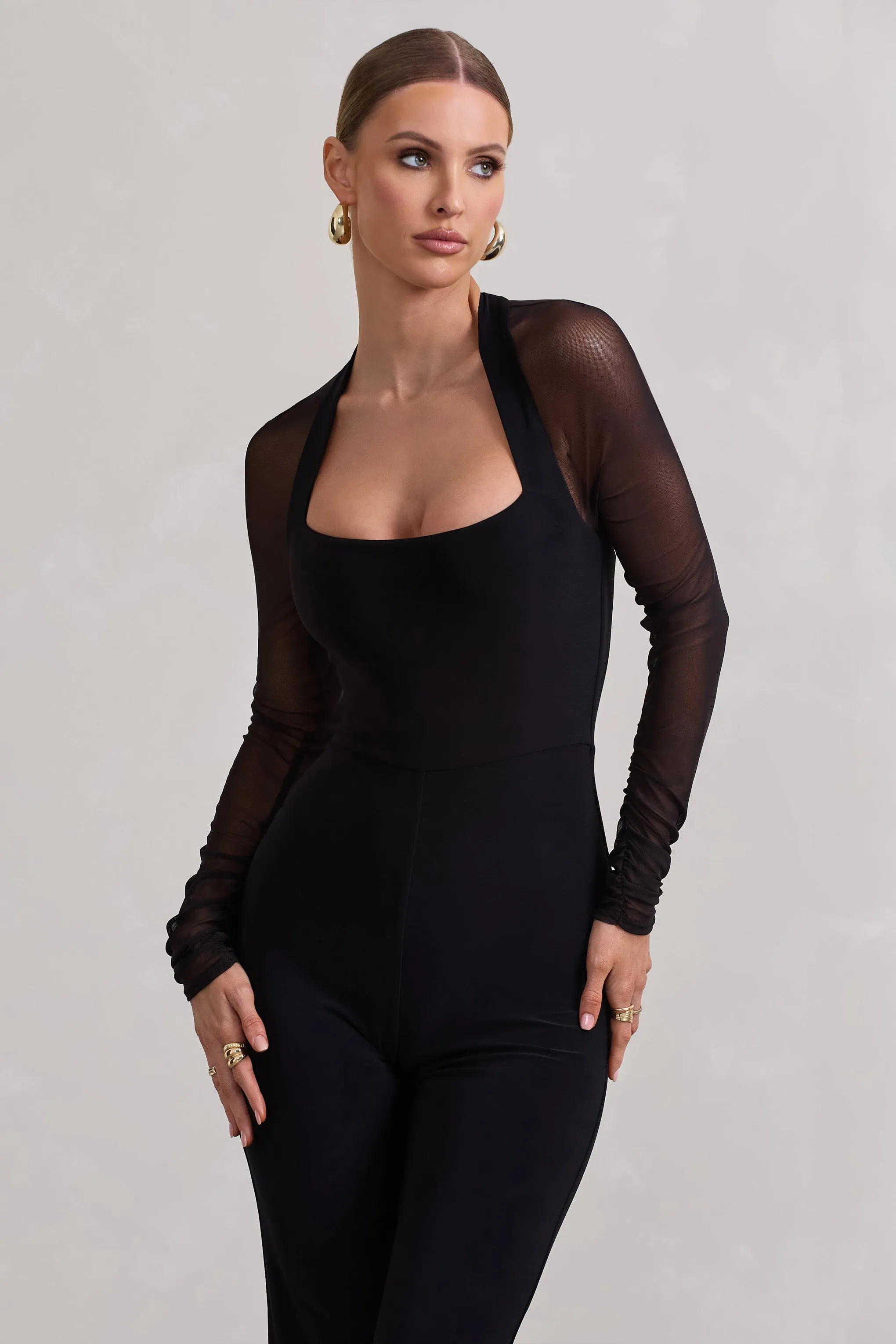 On Track | Black Flared-Leg Jumpsuit With Sheer Sleeves